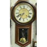 A mahogany drop dial wall clock with Roman numerals to the chapter ring and subsidiary seconds dial,