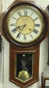 A mahogany drop dial wall clock with Roman numerals to the chapter ring and subsidiary seconds dial,