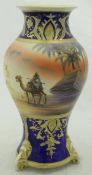 A Noritake baluster shaped vase decorated with camel and tent with pyramid in background,