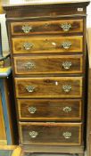 A 20th Century mahogany and cross banded chest of six short drawers in the Georgian manner