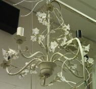 A modern white painted electrolier with floral decoration,