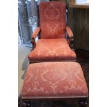 A modern Harrods arm chair with mahogany frame and terracotta upholstery raised on ringed nad