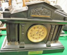 A Victorian black slate cased mantle clock of architectural form,