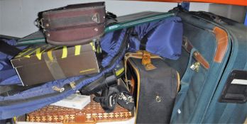 Assorted items to include three suitcases, a Yamaha drum machine, an inflatable mattress,