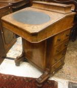 A Victorian walnut and inlaid Davenport desk