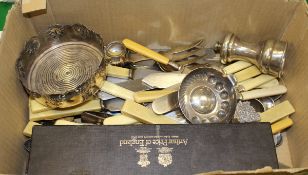 An Edward Jones silver plated wine taster, assorted cutlery, a sugar caster, candlesticks,