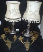 A pair of twin branch brass candelabra and a near matching pair of table lamps with embroidered