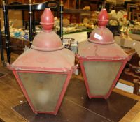 A pair of red painted outside lamps marked "D W Windsor"