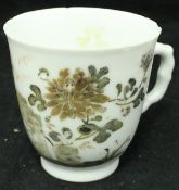 A Chinese export teacup with floral decoration CONDITION REPORTS Numnerous small