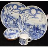 A pair of Chinese blue and white decorated plates with script to front and two figures,