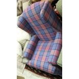 A modern Wesley Barrel wing back arm chair in purple and blue tartan raised on cabriole legs