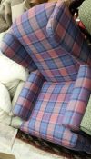 A modern Wesley Barrel wing back arm chair in purple and blue tartan raised on cabriole legs