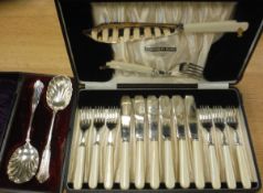 A cased fish knife and fork set and a pair of cased serving spoons