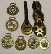 Nine assorted horse brasses to include one featuring shire horse pulling a cart,