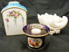 A Coalport style inkwell in cobalt blue with gilt decoration and armorial to the side,