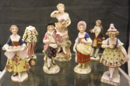Six Sampson porcelain figurines with gilt anchor mark to the bases and one further similar figurine