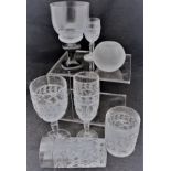 A collection of cut glass wine glasses and tumblers,