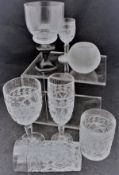 A collection of cut glass wine glasses and tumblers,
