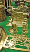 Two brass door stops in the form of horses, a twin branch adjustable brass candelabra,