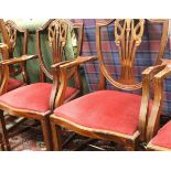 A set of seven modern mahogany dining chairs in the Chippendale style