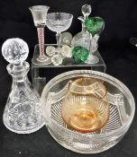 A large collection of cut glassware, including champagne glasses, green coloured sherry glasses,