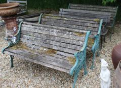 Four various slatted garden benches with painted metal ends