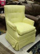 A 19th Century curved back tub chair raised on square tapering reeded legs with yellow upholstery