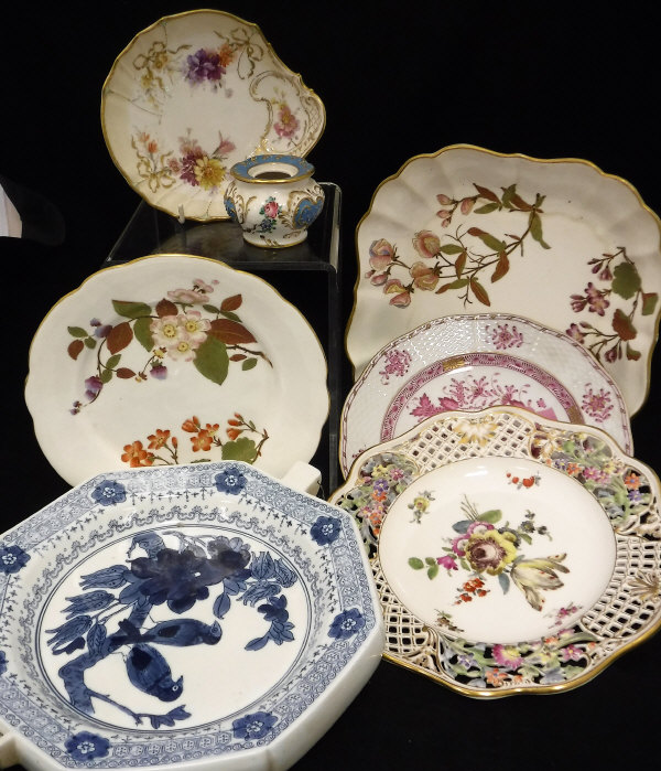 A quantity of Royal Worcester W1701 plates and bowls decorated in the Aesthetic taste with puce