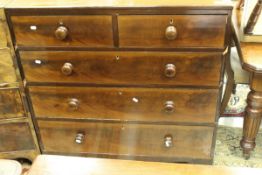 A mahogany square front chest of two short over three long graduated drawers