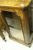 A Victorian walnut and inlaid side cabinet with single glazed door
