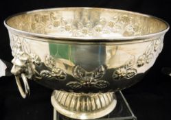A silver plated and embossed punch bowl with lion mask drop ring handles,