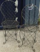 A pair of wirework garden chairs