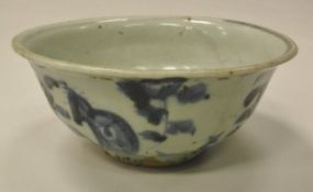 A Chinese bowl decorated in white and blue foliate pattern,