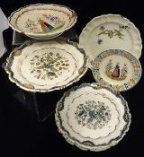 A Henriot Quimper plate decorated with figure in a garden, together with a footed bowl,