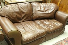 A pair of modern brown leather Laura Ashley two seat scroll arm sofas CONDITION REPORTS