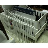 A modern white cot, together with a white toddlers bed, baby playpen, baby gate,