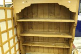 A modern pine dresser top, together with a modern pine four tier free standing bookcase,