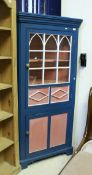 An early 19th Century corner cupboard with alterations,