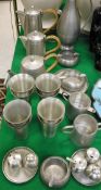 A collection of Selangor pewter wares to include teapot, coffee pot, hot water pot, various beakers,