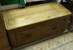A low pine bench with drawer under on turned feet