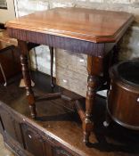 A walnut occasional table,