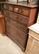 An oak and cross banded chest of two short over four long drawers to bracket feet