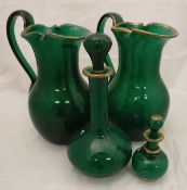 Two large mottled green "malachite" glass ewers with applied gilt decoration,
