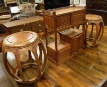 A pair of Chinese hardwood occasional tables of circular form,