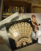 A box of assorted records to include examples by Phil Collins, Elke Brooks and Tina Turner,