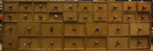 A pine bank of 40 Apothecary drawers