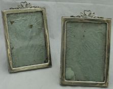 A pair of Edwardian silver photo frames,