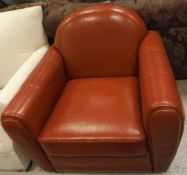 A modern red leatherette arm chair
