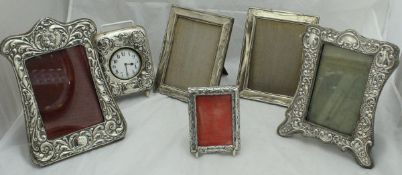 A pair of silver photo frames,