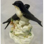 A Meissen figural group of two house martins bearing blue crossed swords mark and stamped "J192" to